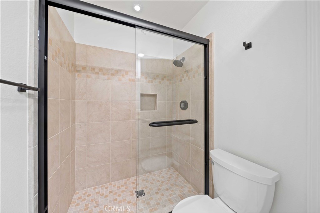 22 Oak Tree Drive Rancho Mirage, CA 92270 - Photo 14 of 25 a bathroom with a shower and toilet