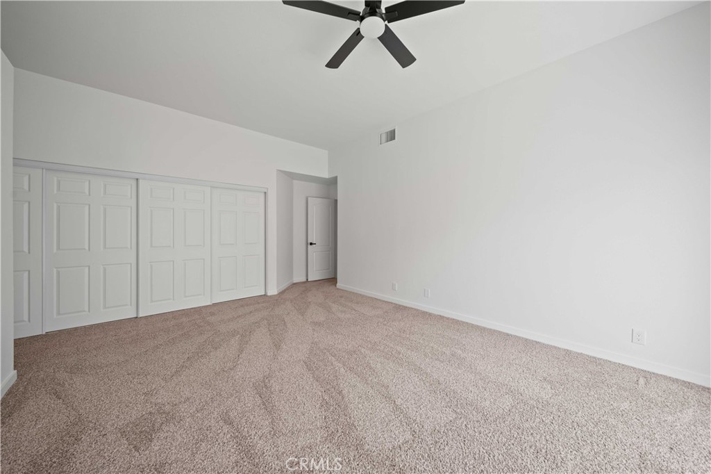 22 Oak Tree Drive Rancho Mirage, CA 92270 - Photo 16 of 25 a view of a livingroom with a ceiling fan