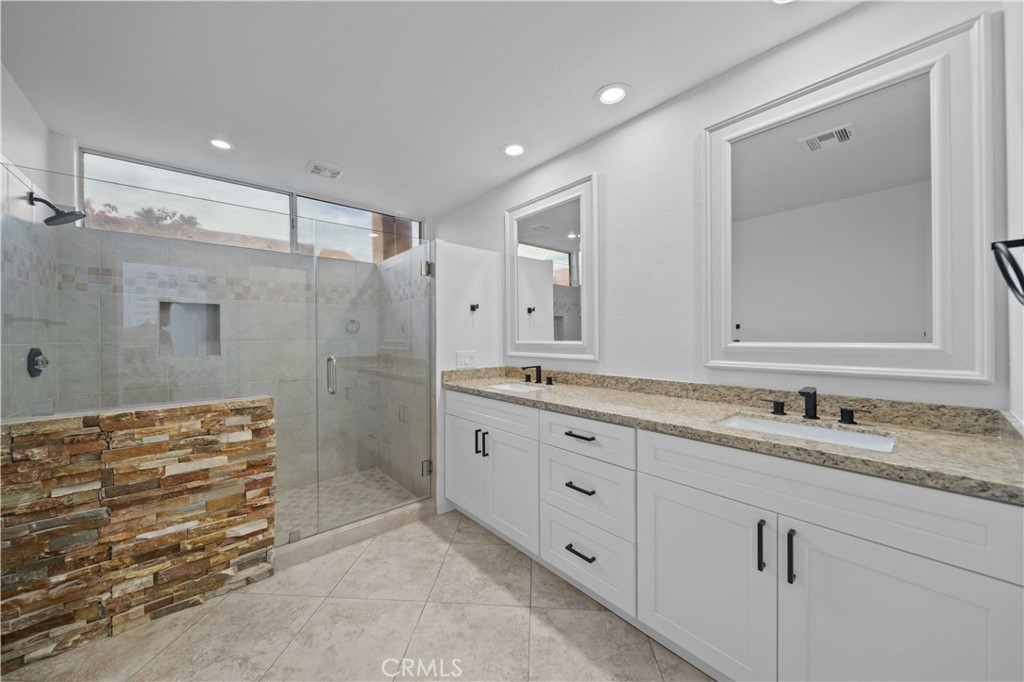 22 Oak Tree Drive Rancho Mirage, CA 92270 - Photo 17 of 25 a bathroom with a granite countertop sink mirror and double