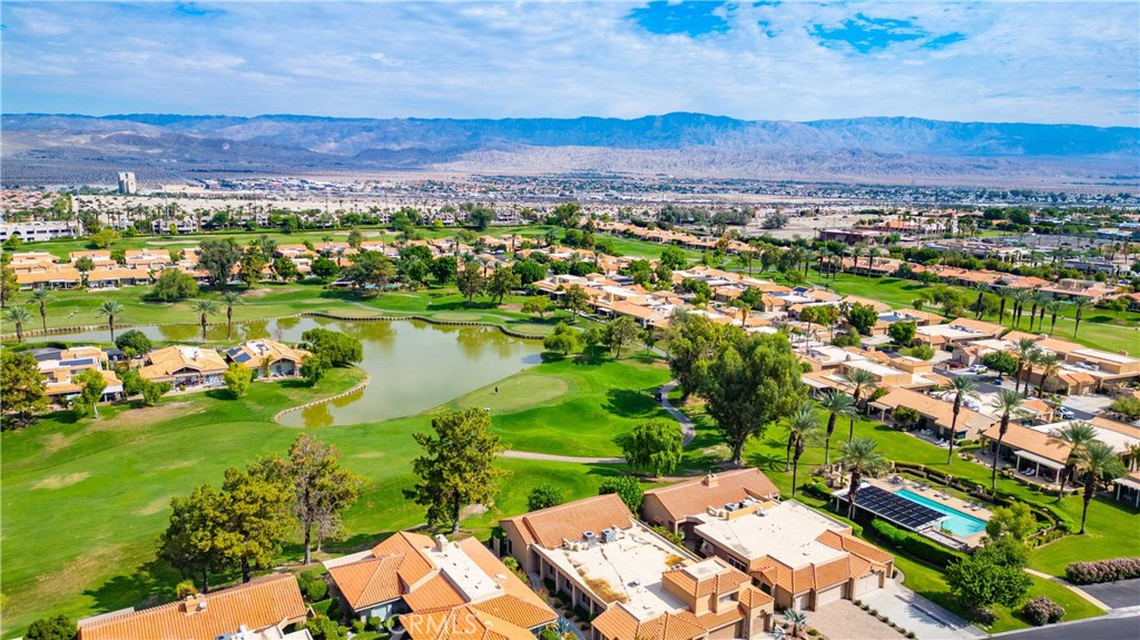 22 Oak Tree Drive Rancho Mirage, CA 92270 - Photo 25 of 25 an aerial view of a city with lots of residential buildings ocean and mountain view in back