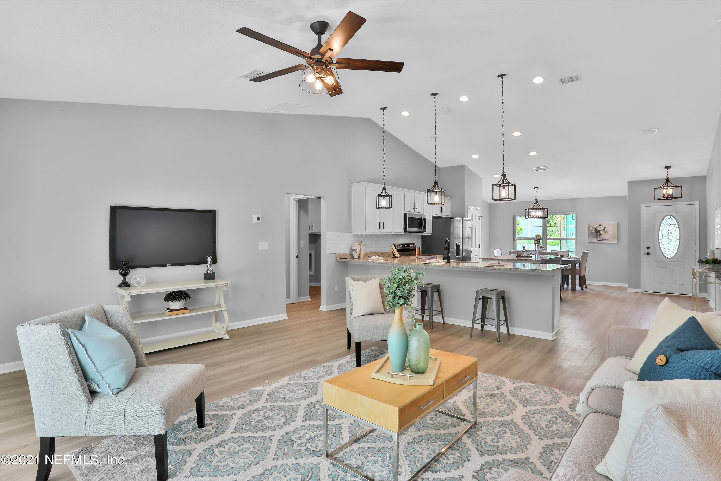 6442 Heidi Road Jacksonville, FL 32277 - Photo 2 of 30 a living room with furniture and a flat screen tv
