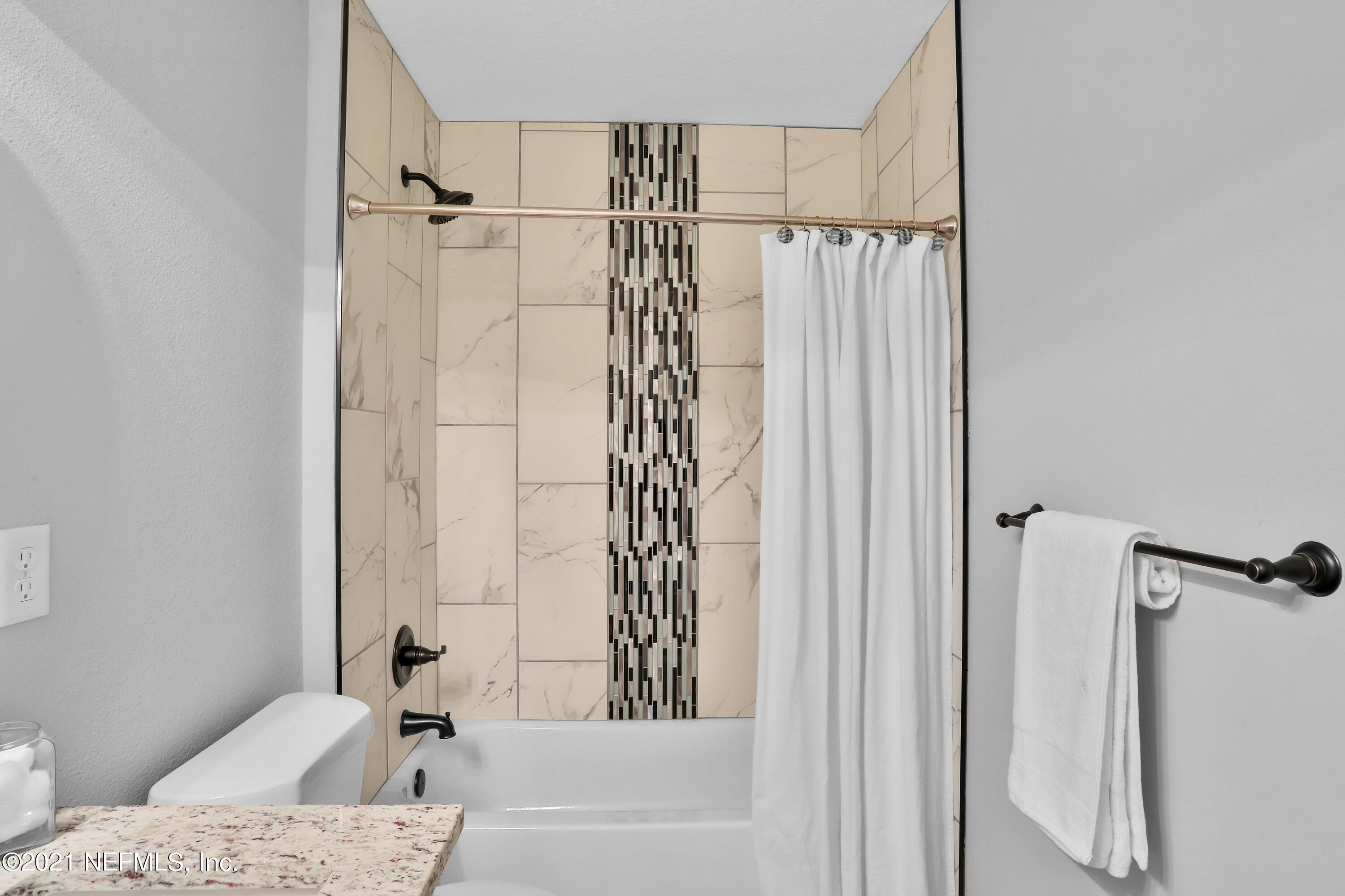 6442 Heidi Road Jacksonville, FL 32277 - Photo 24 of 30 a bathroom with a bathtub and shower