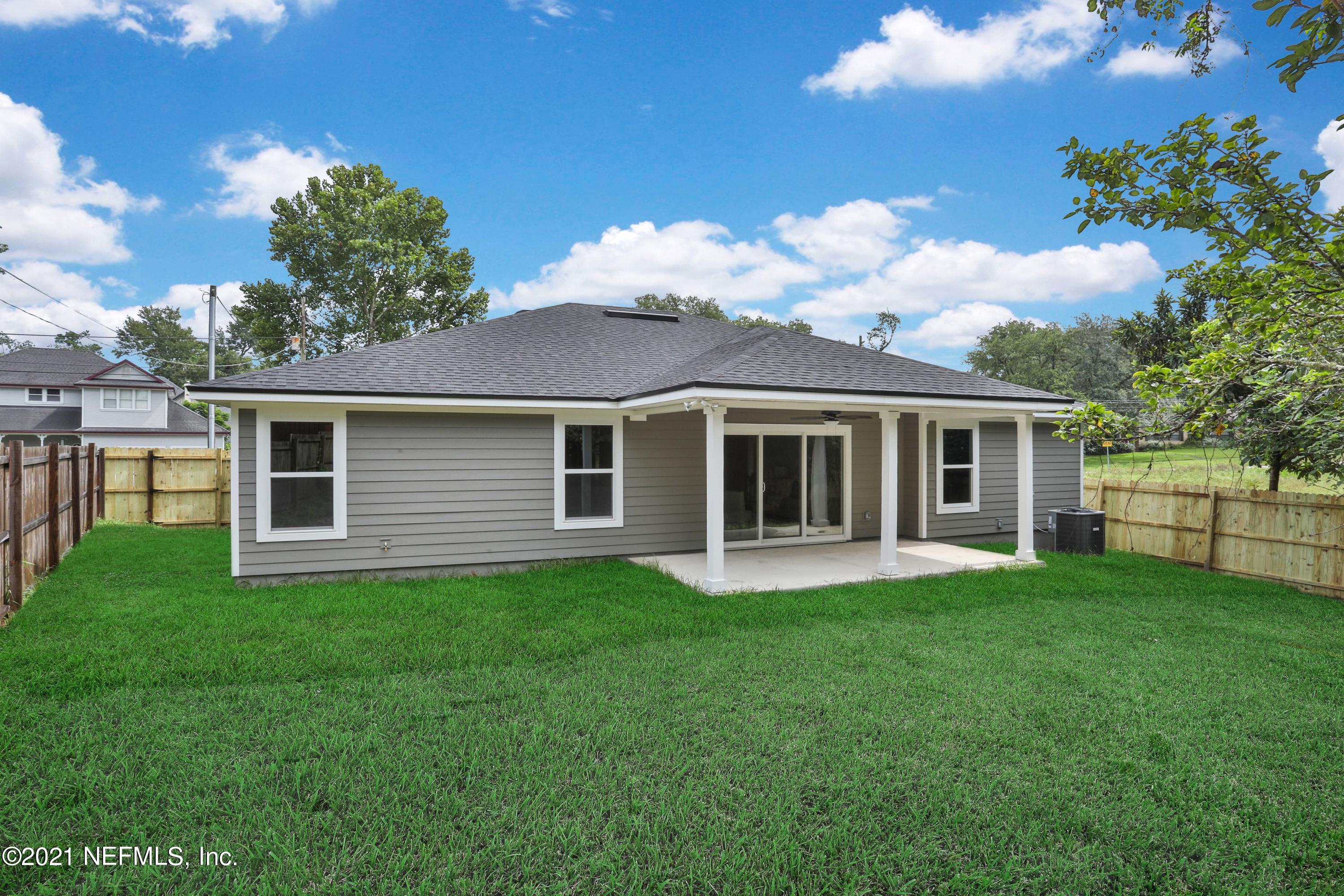 6442 Heidi Road Jacksonville, FL 32277 - Photo 28 of 30 a front view of a house with a garden