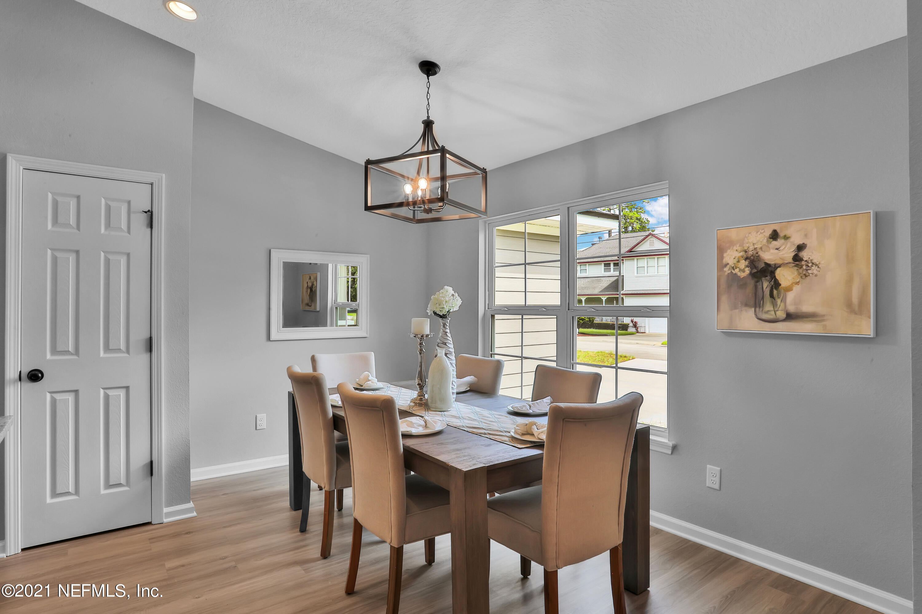 6442 Heidi Road Jacksonville, FL 32277 - Photo 7 of 30 a view of a dining room with furniture window and wooden floor