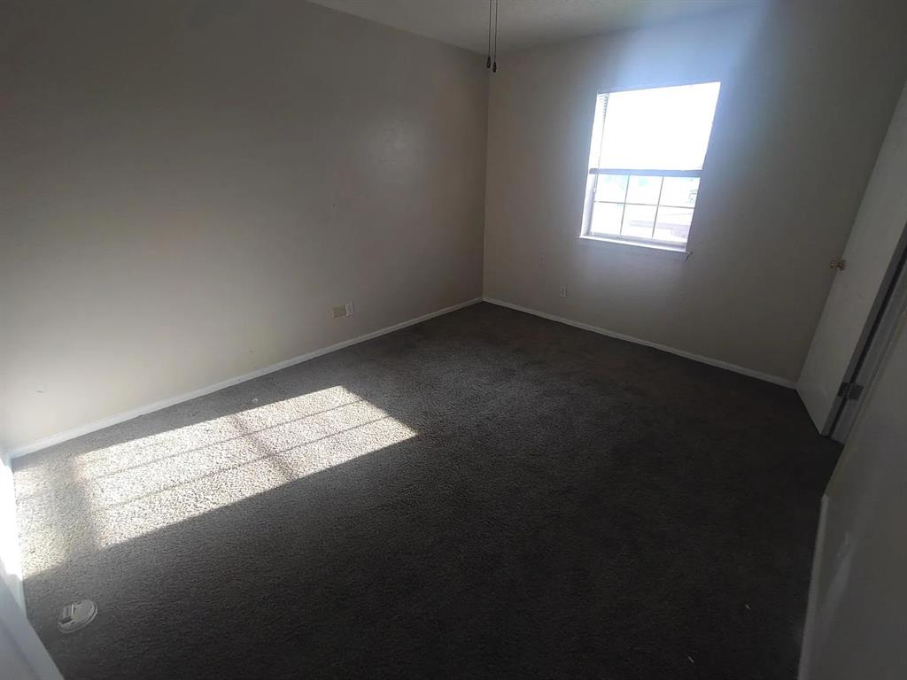 7816 Romney Road, Unit 3 Fort Worth, TX 76134 - Photo 11 of 18 a view of an empty room with a window