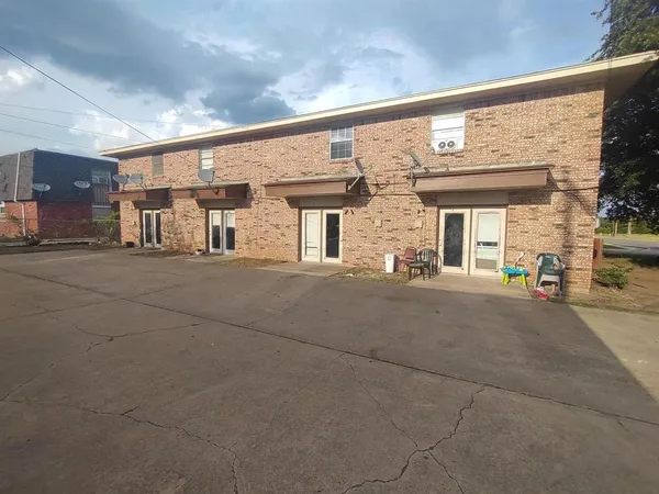 a view of a building with a street