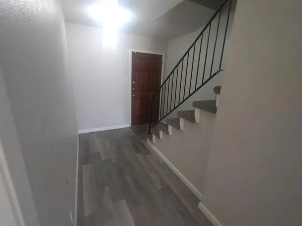 a view of entryway with wooden floor