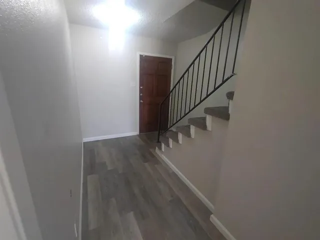 a view of entryway with wooden floor