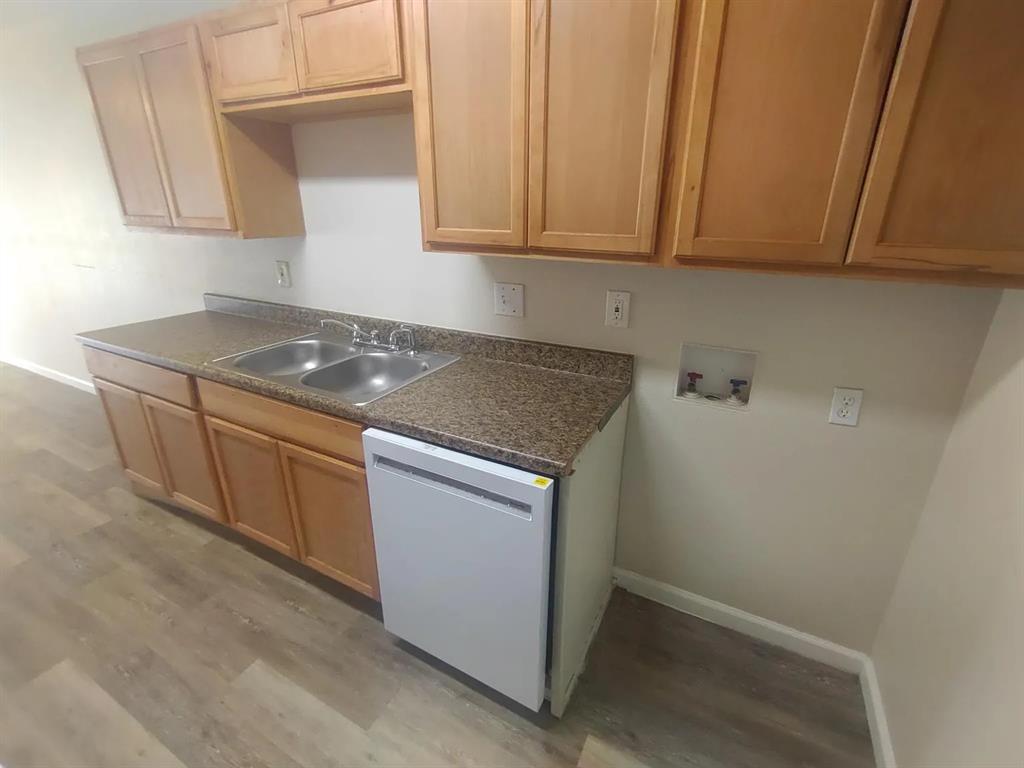 7816 Romney Road, Unit 3 Fort Worth, TX 76134 - Photo 8 of 18 a stove top oven sitting inside of a kitchen