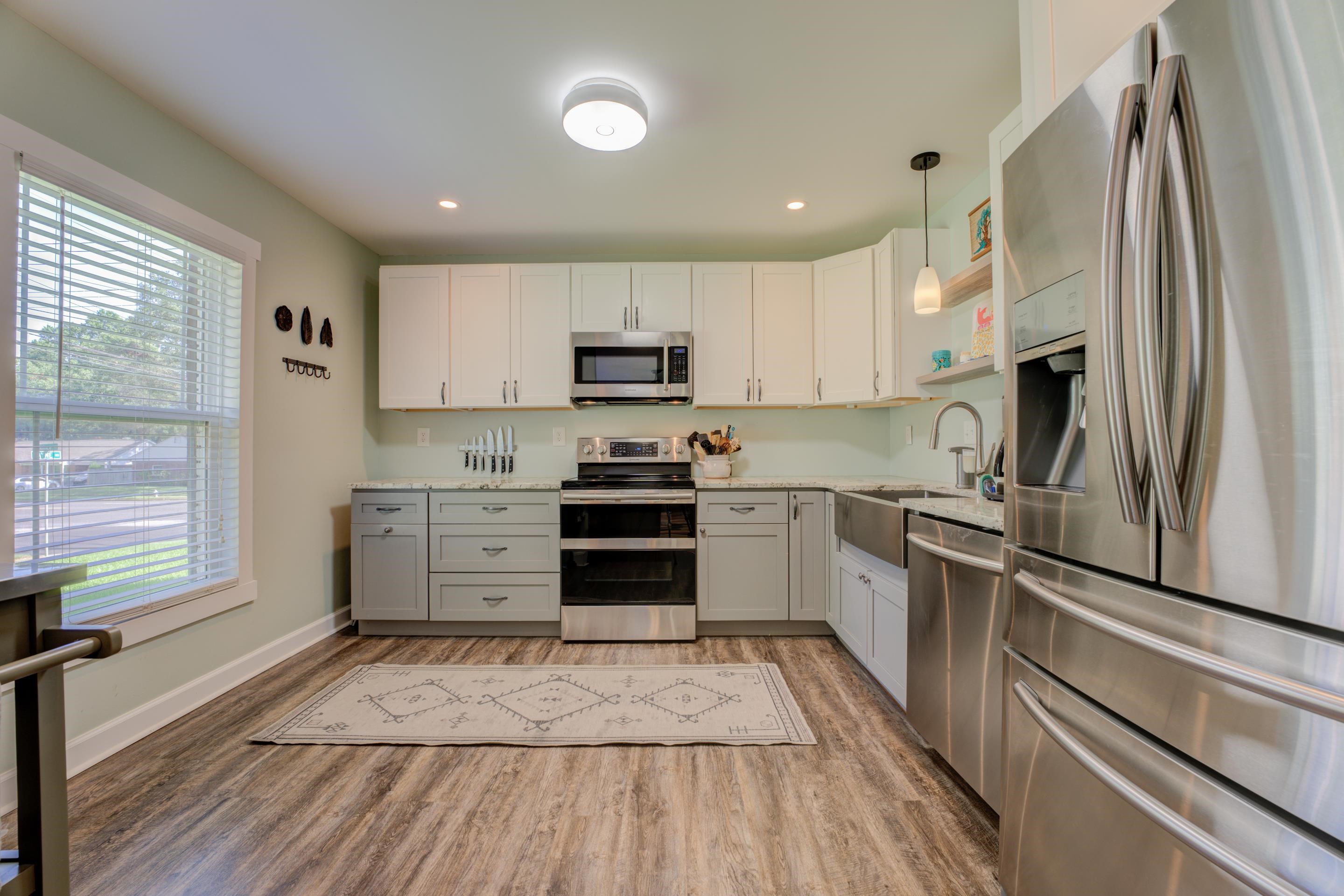 1501 Hayne Road Memphis, TN 38119 - Photo 4 of 33 a kitchen with stainless steel appliances a refrigerator sink and microwave
