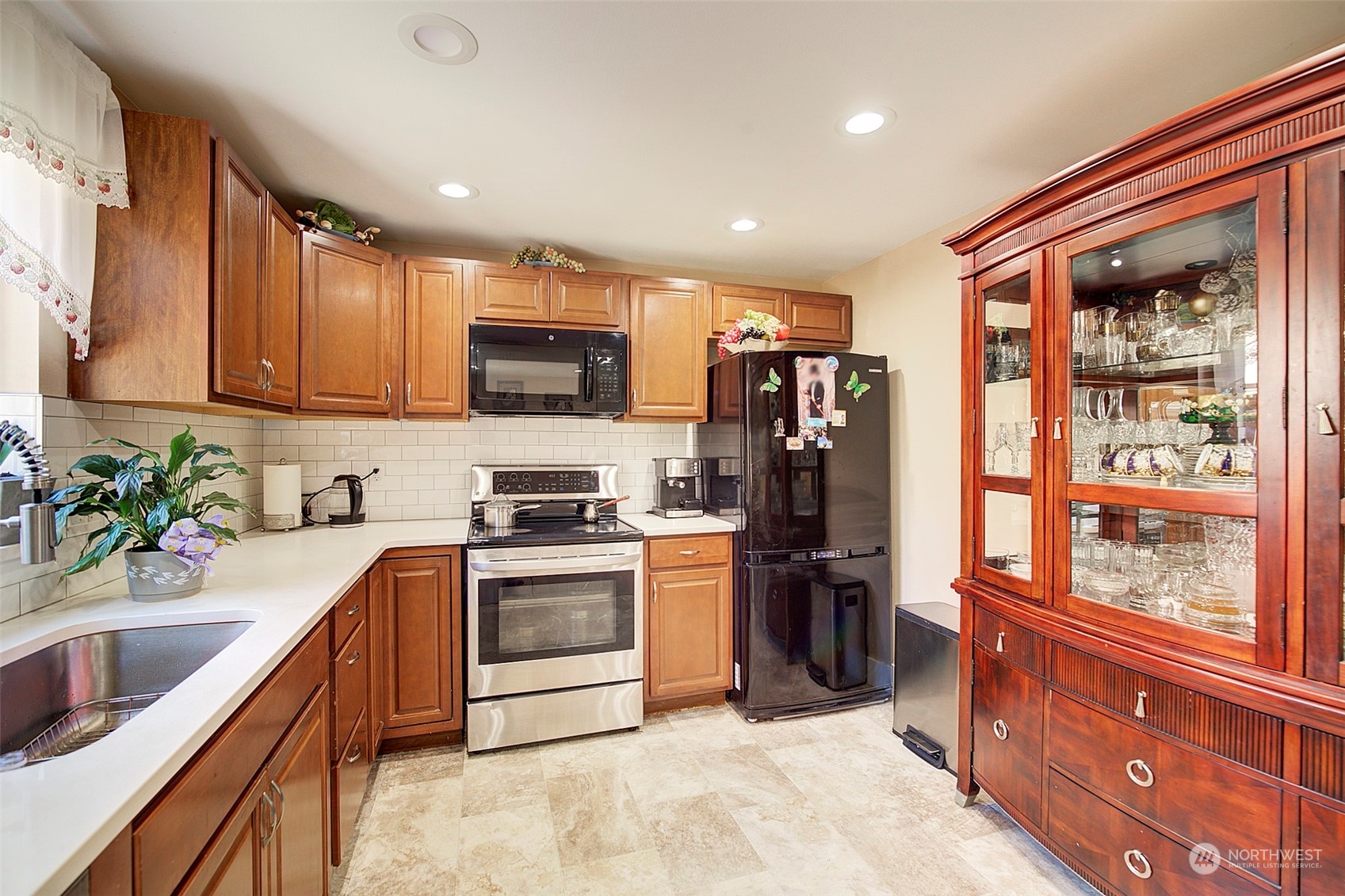 11717 2nd Drive Southeast, Unit A & B Everett, WA 98208 - Photo 18 of 40 a kitchen with stainless steel appliances granite countertop a refrigerator a stove top oven a sink and dishwasher