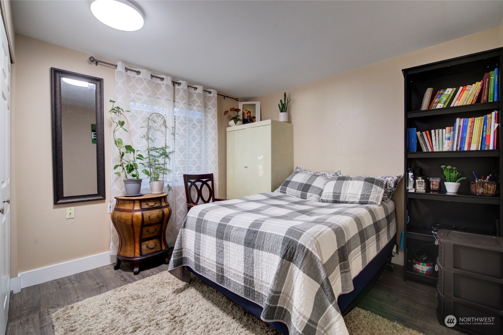 11717 2nd Drive Southeast, Unit A & B Everett, WA 98208 - Photo 19 of 40 a bedroom with a bed a dresser and book shelf
