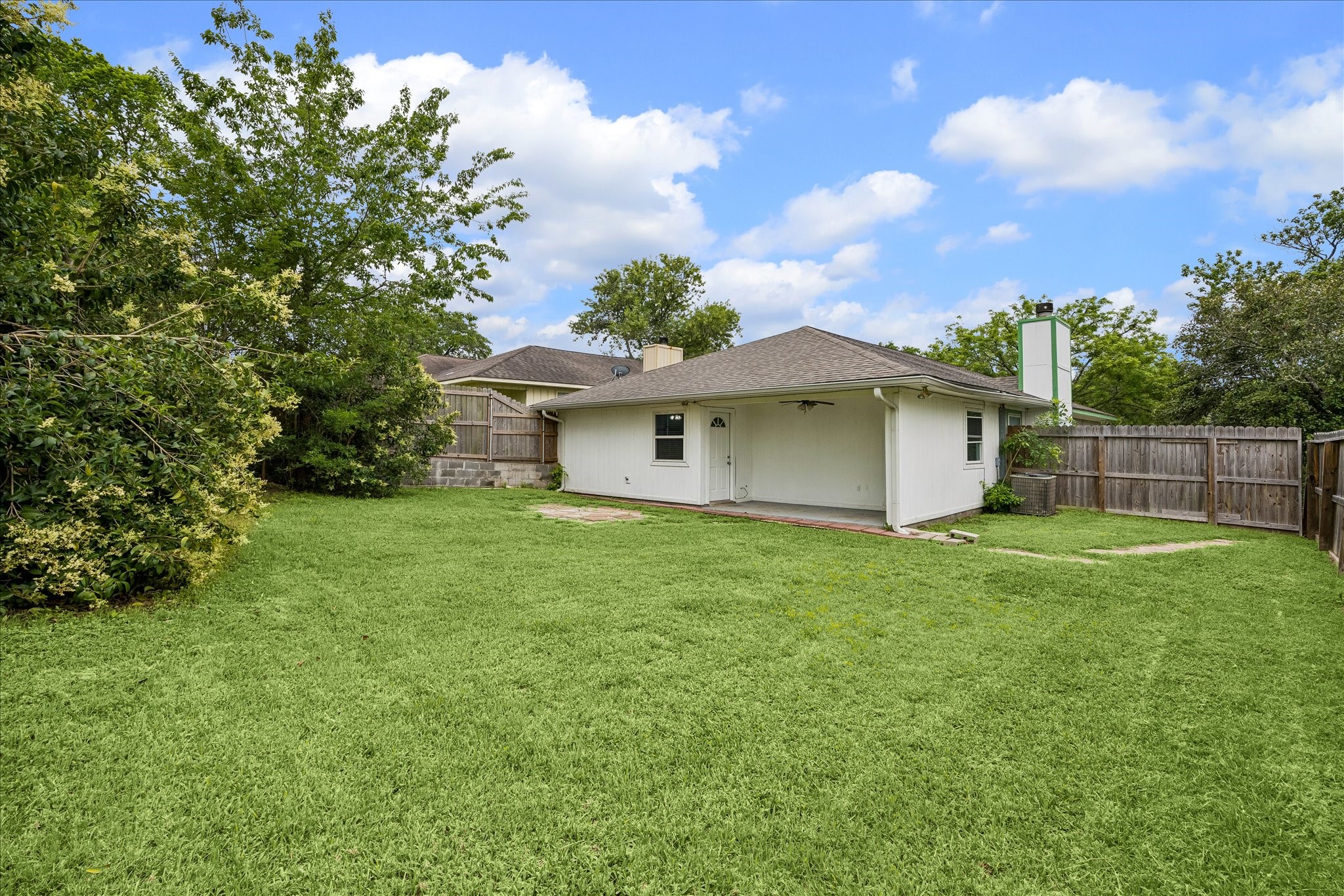 206 Lockett Street Brenham, TX 77833 - Photo 12 of 12 a view of a house with a backyard