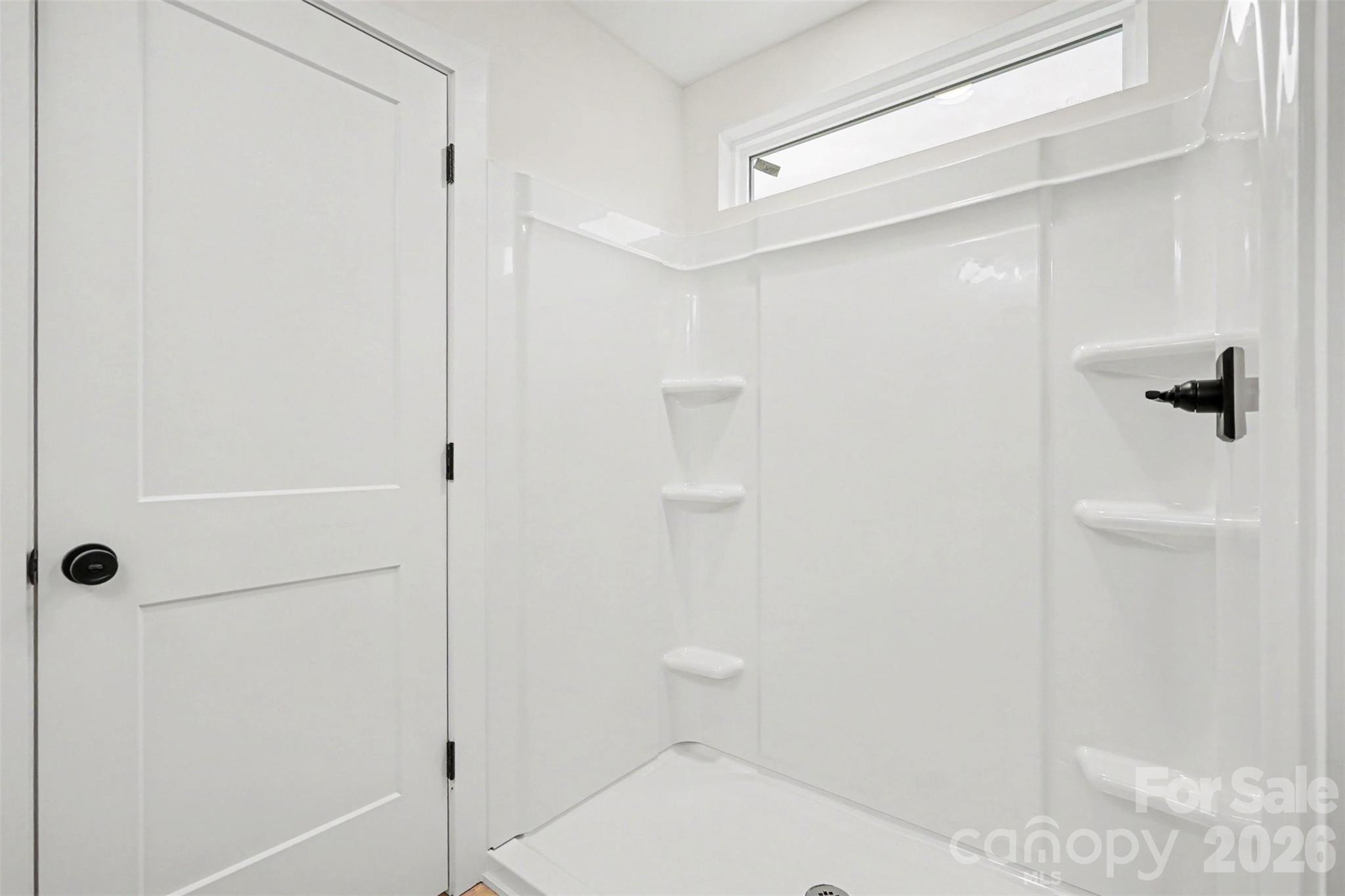 7521 Lawyers Road Charlotte, NC 28227 - Photo 27 of 35 a bathroom with a shower and a toilet