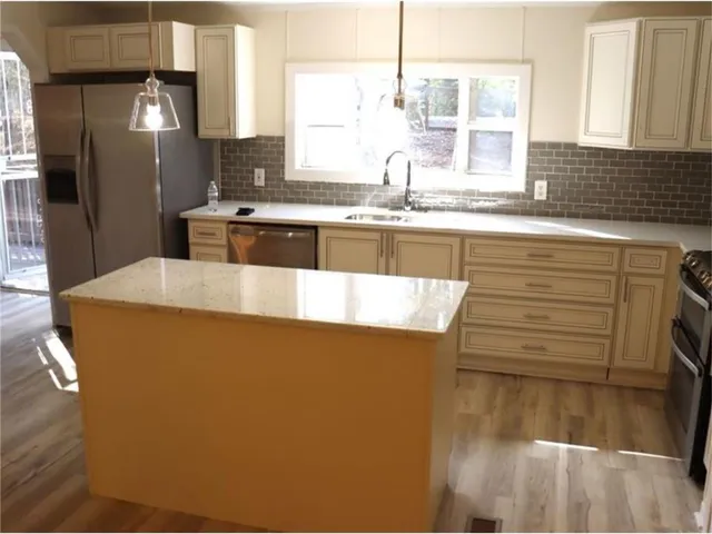 a view of a dining room with furniture window and outside view