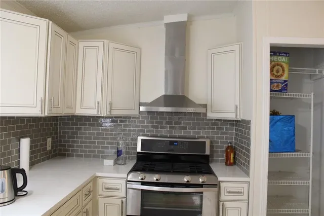 a view of a dining room with a table and chairs