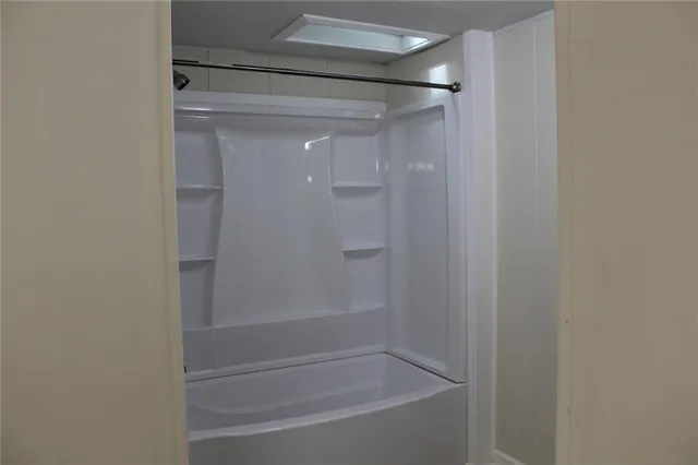 a white toilet sitting next to a sink