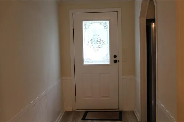 a kitchen with stainless steel appliances granite countertop a sink a stove and a refrigerator