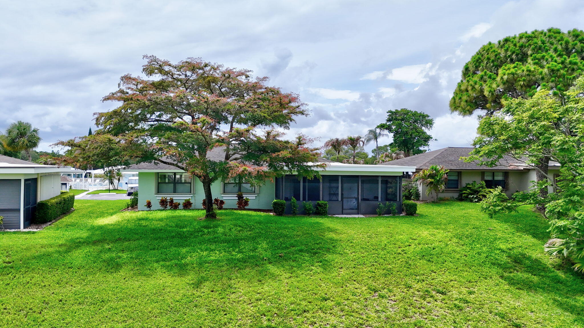 5251 Southeast Sea Island Way Stuart, FL 34997 - Photo 46 of 68 a view of a house with a yard and sitting area