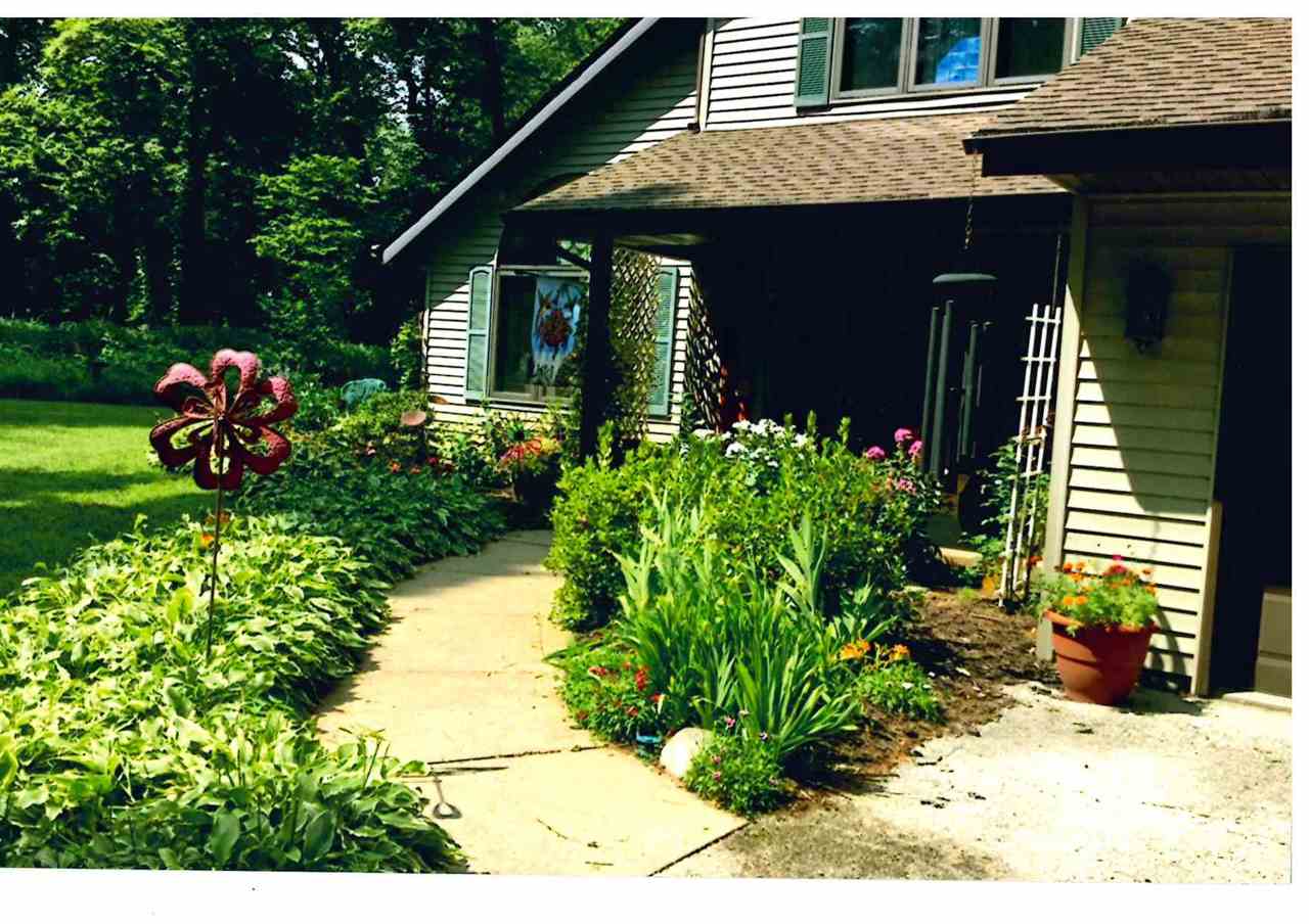 3745 Freeport Road Rockton, IL 61072 - Photo 2 of 24 a front view of a house with a yard