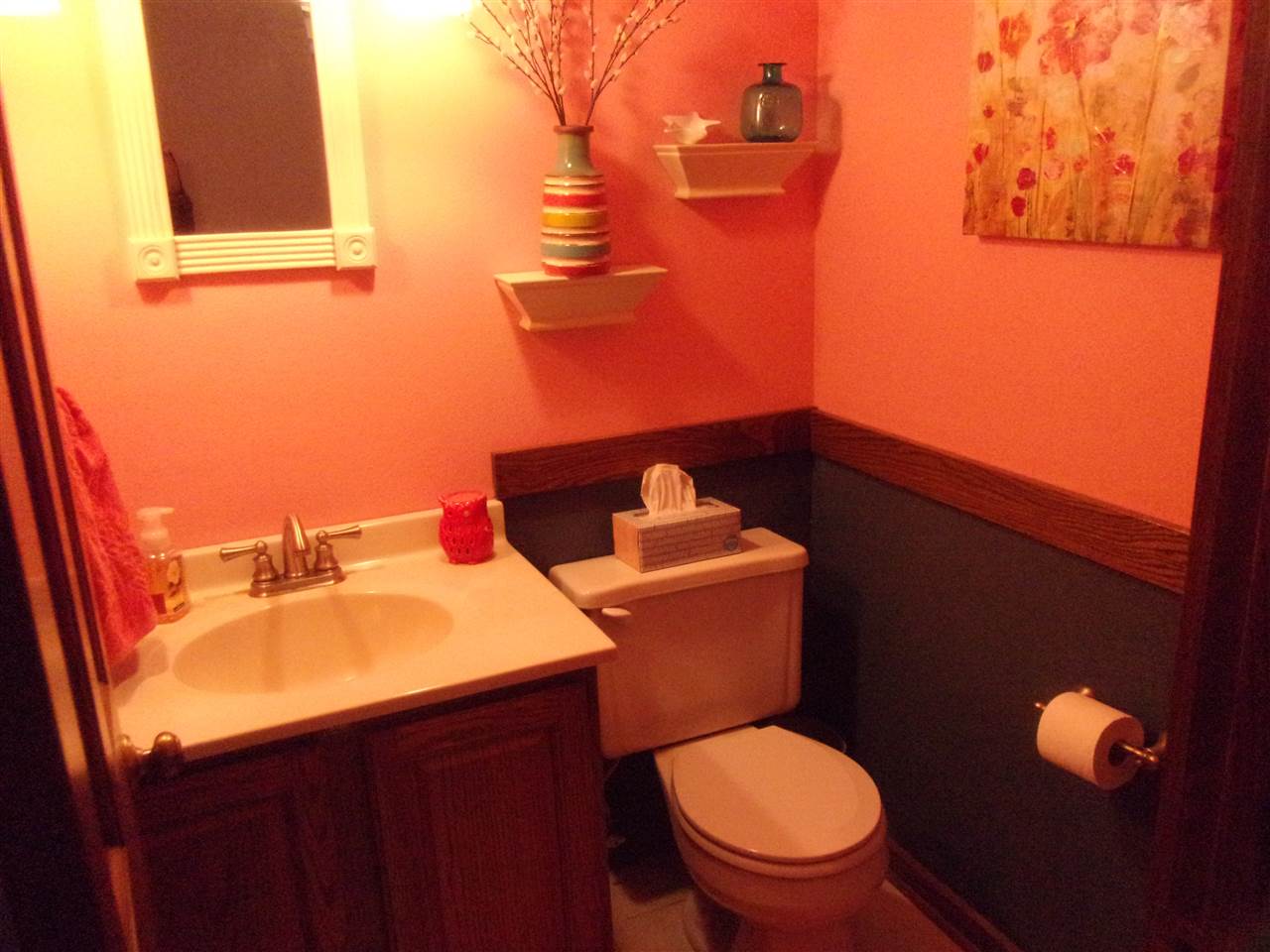 3745 Freeport Road Rockton, IL 61072 - Photo 21 of 24 a bathroom with a toilet mirror and vanity