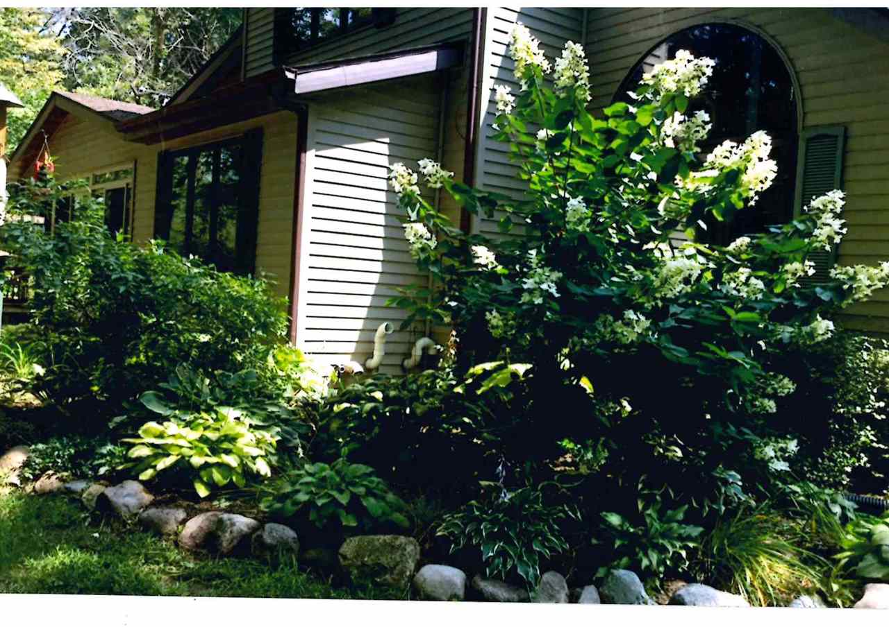 3745 Freeport Road Rockton, IL 61072 - Photo 5 of 24 a view of a house with a tree