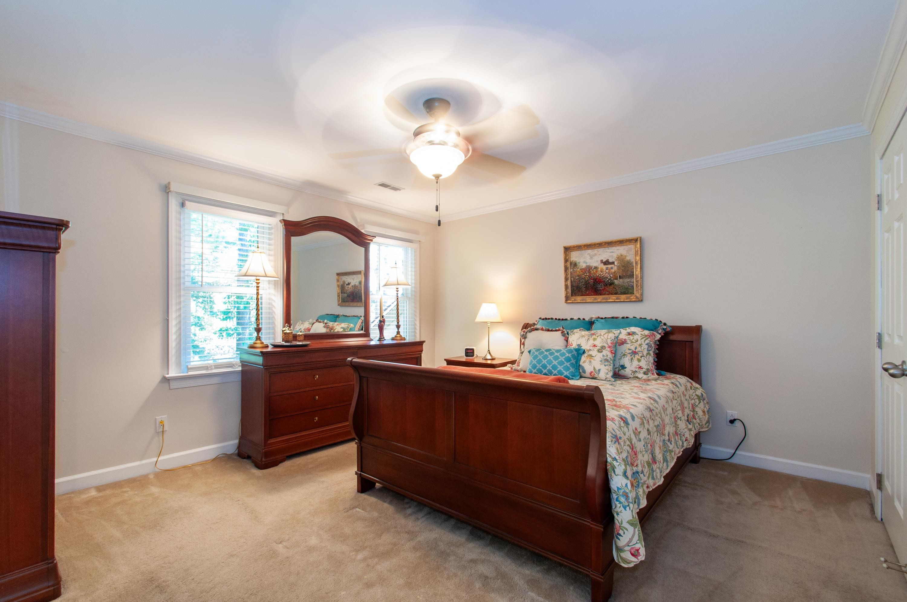 7914 Footman Way Raleigh, NC 27615 - Photo 12 of 38 a bedroom with a bed and a large window