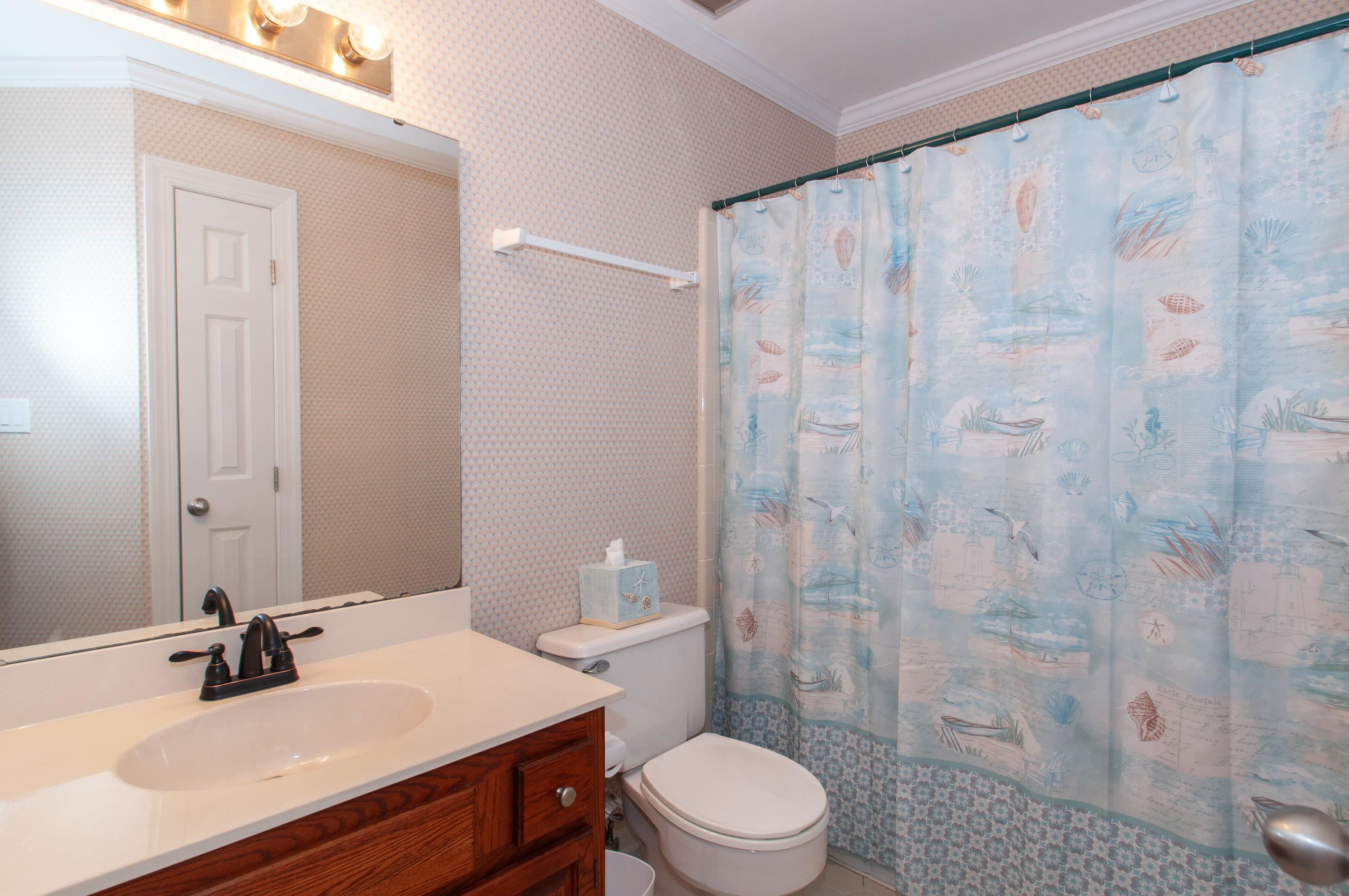 7914 Footman Way Raleigh, NC 27615 - Photo 22 of 38 a bathroom with a sink a toilet and shower