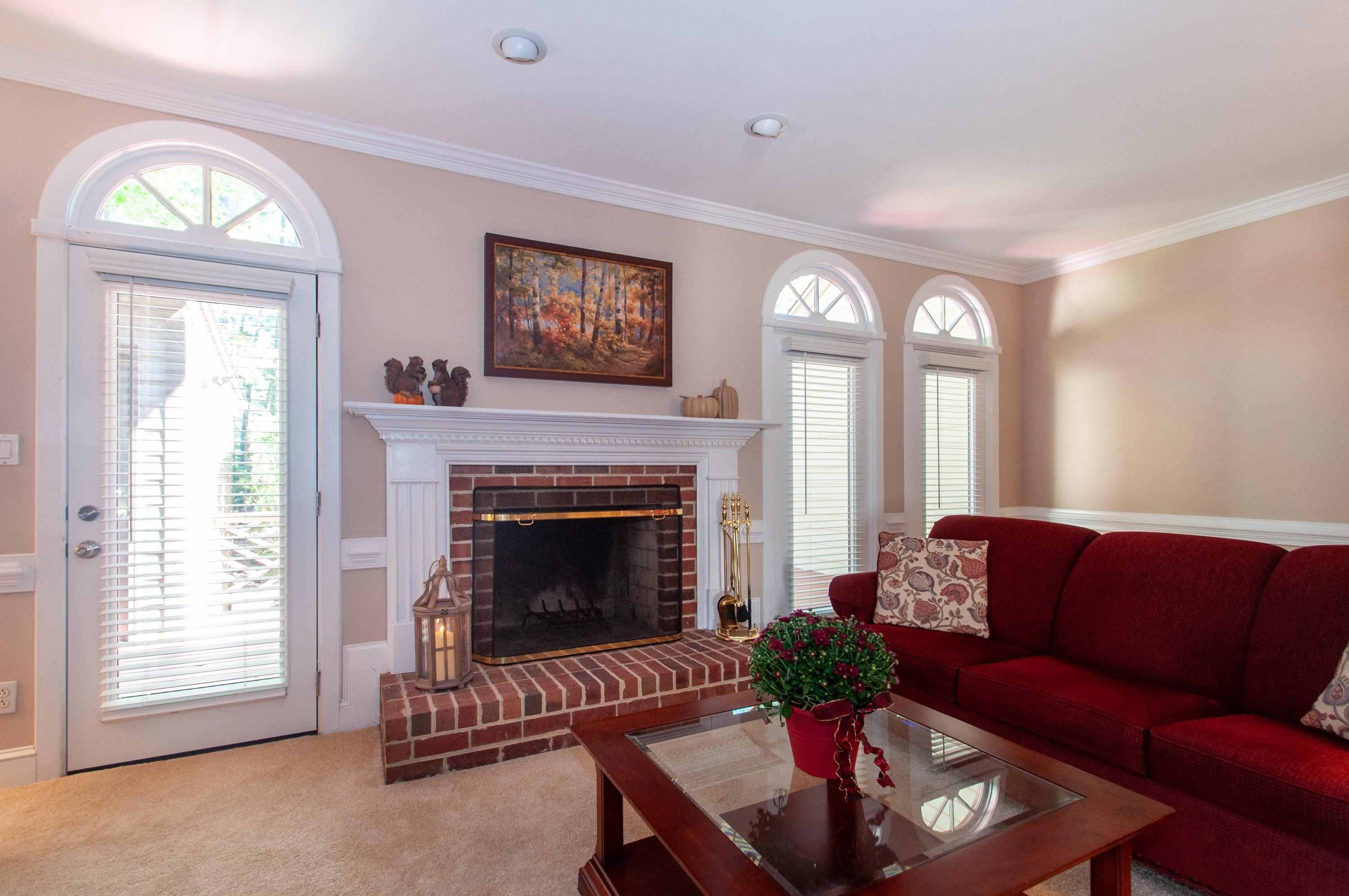 7914 Footman Way Raleigh, NC 27615 - Photo 5 of 38 a living room with furniture and a fireplace