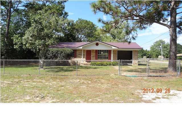6184 Old Hickory Road Crestview, FL 32539 - Photo 1 of 14 a view of a swimming pool with a yard