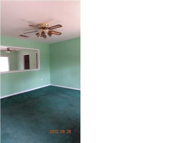 6184 Old Hickory Road Crestview, FL 32539 - Photo 3 of 14 a living room with a fireplace furniture and a potted plant
