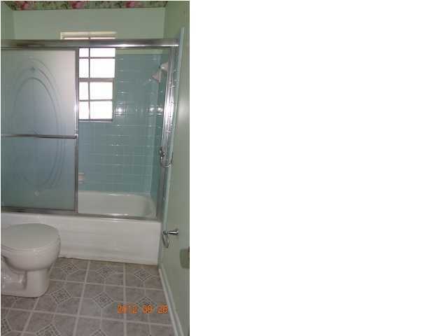 6184 Old Hickory Road Crestview, FL 32539 - Photo 10 of 14 a bathroom with a toilet and a shower
