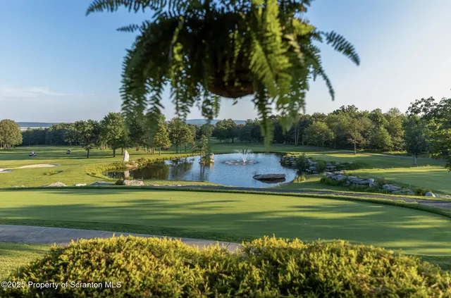 a view of a golf course with a lake