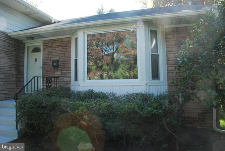 6002 Greentree Road Bethesda, MD 20817 - Photo 4 of 14 a view of a house with a yard