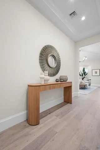 a spacious bathroom with a double vanity sink and a mirror
