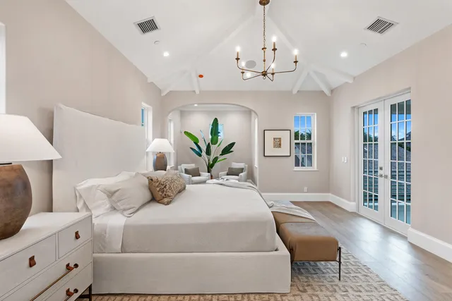 a bathroom with a double vanity sink a toilet and shower