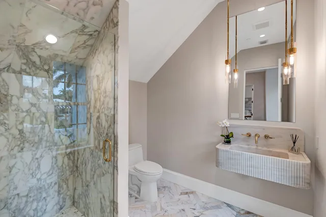 a view of a livingroom with furniture and a potted plant