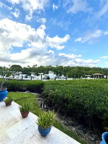 a large kitchen with kitchen island granite countertop a large counter top and sink
