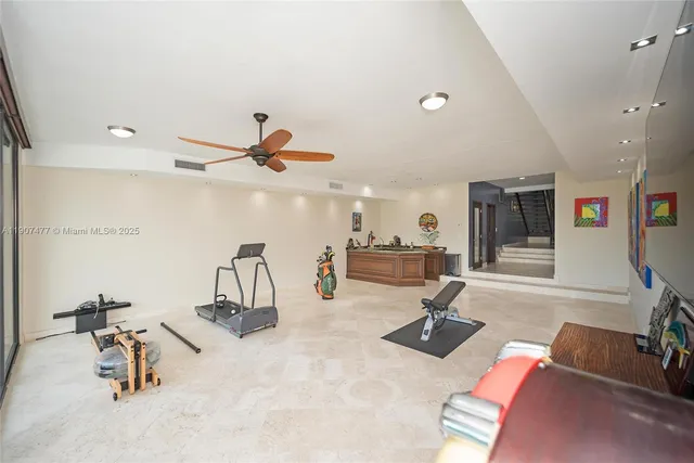 a view of a dining room with furniture a chandelier and wooden floor