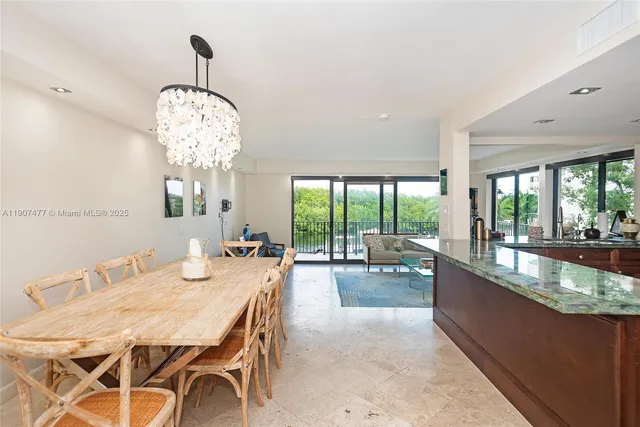 a spacious bedroom with a large bed and a large window