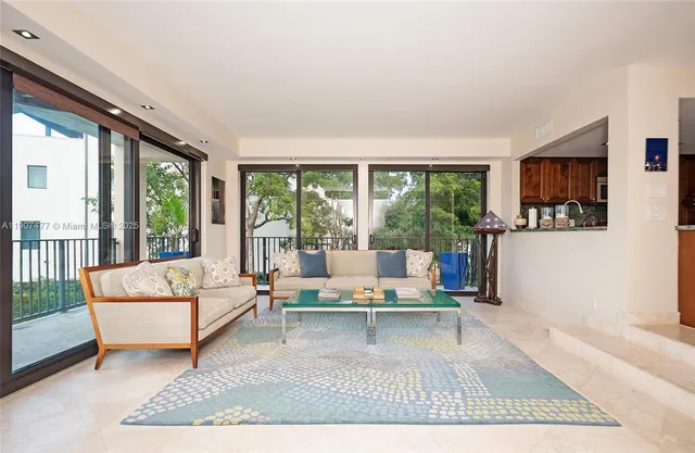 a bedroom with a large bed and a large window