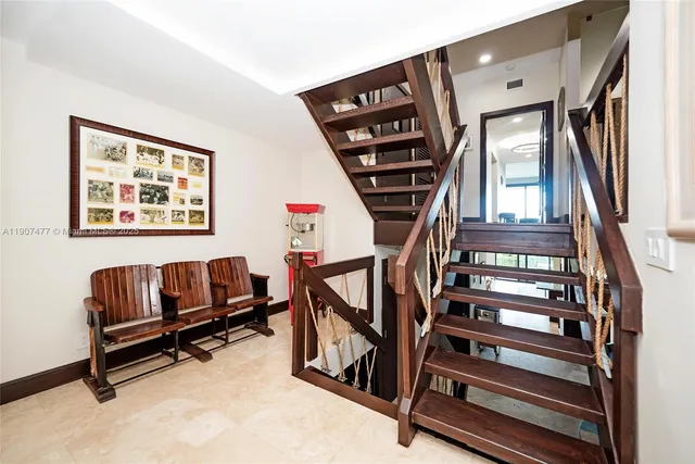 a view of a house with swimming pool and sitting area