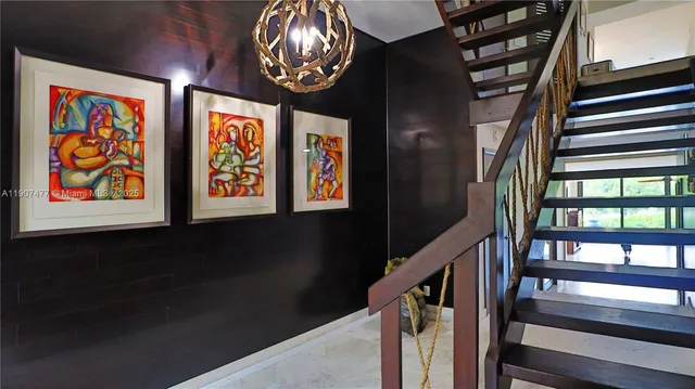 a room with gym equipment and view of living room