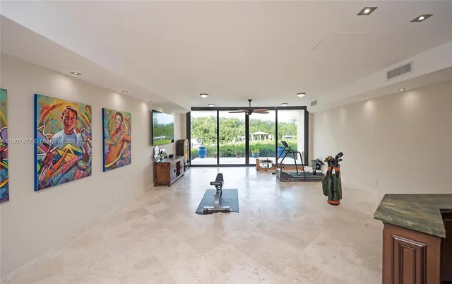 a view of staircase with white walls and a window