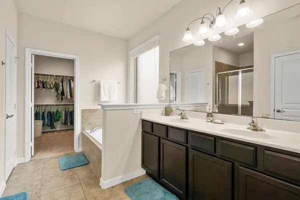 a bathroom with a sink a vanity and a mirror
