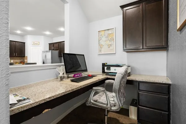 a room with furniture and a flat screen tv