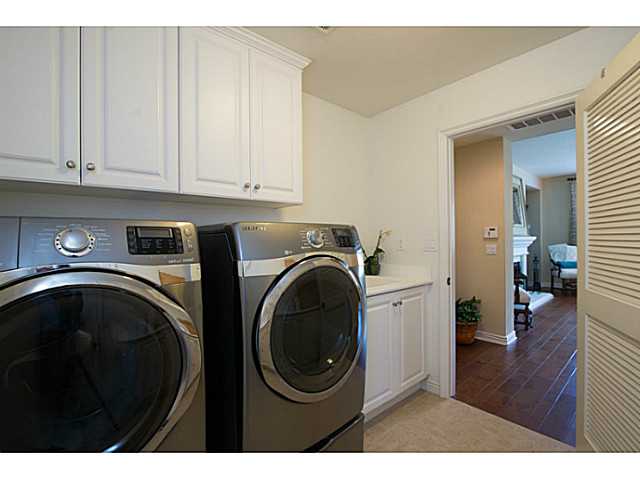 14533 Whispering Ridge Road San Diego, CA 92131 - Photo 14 of 25 Laundry: Downstairs Laundry right off 4-car tandem garage with height enough for overhead storage