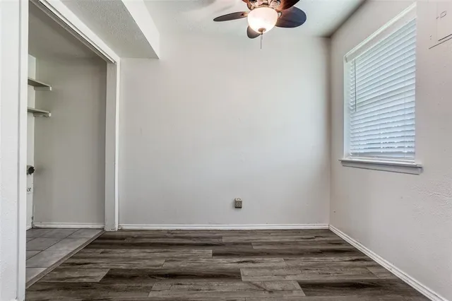 a picture of a bench in front of a wall