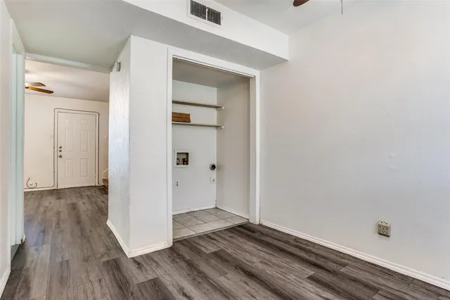 a kitchen with a refrigerator and a stove top oven