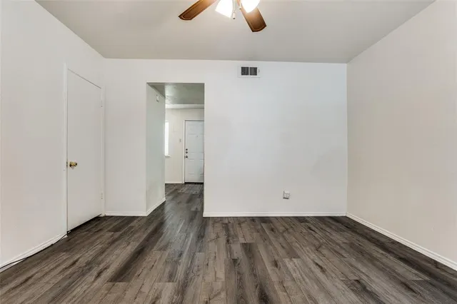a view of room with window wooden floor and carpet